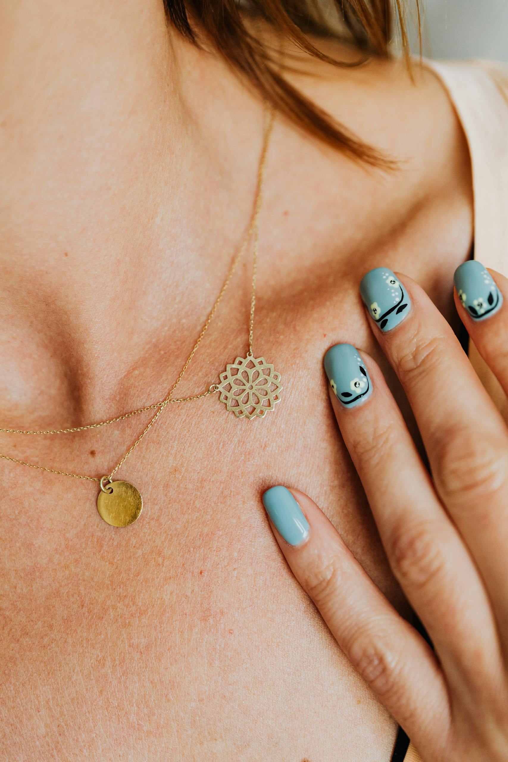 Woman Wearing Gold Necklace